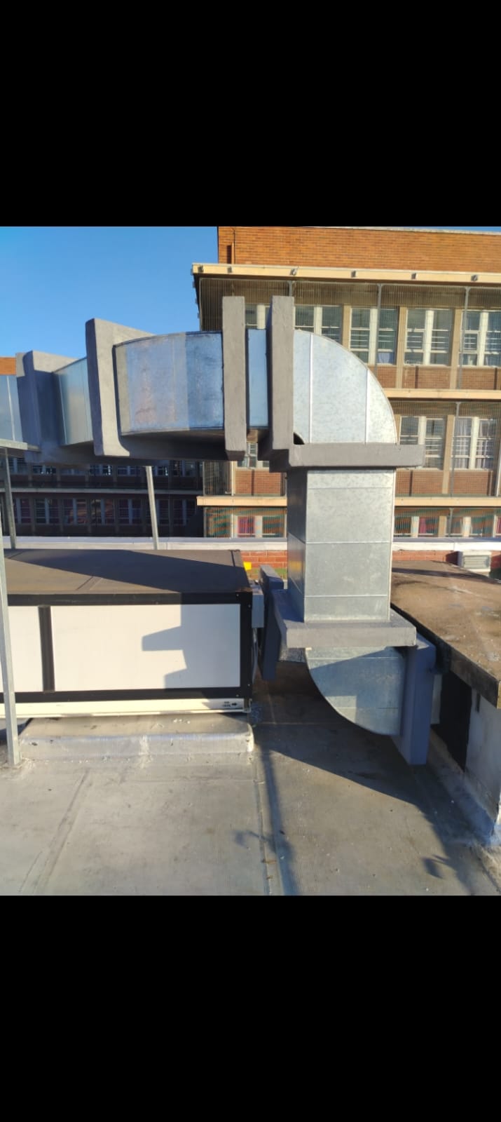 Galvanized duct sections on rooftop