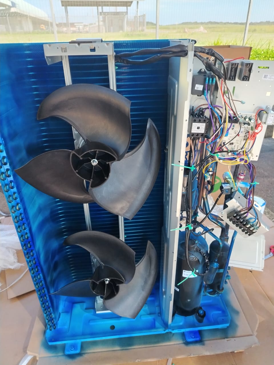 VRV condenser unit internals showing fans and wiring